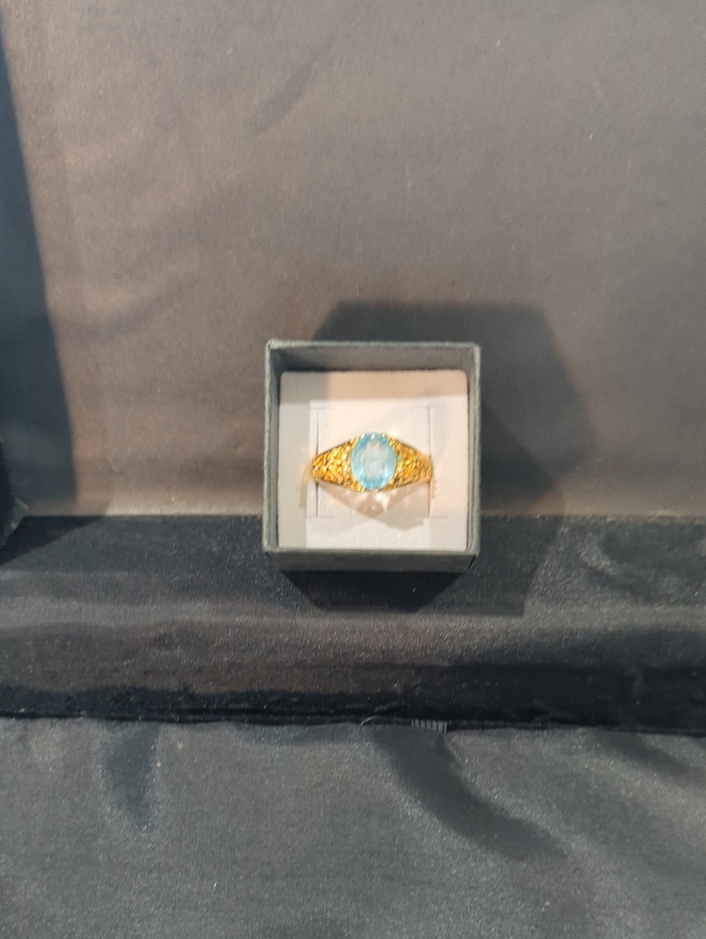 Gold Tone Ring with Blue Oval Stone